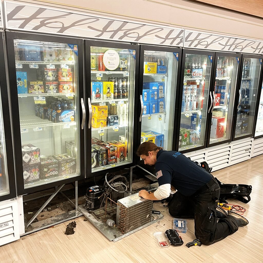Mr. Fridge technician on a grocery store job